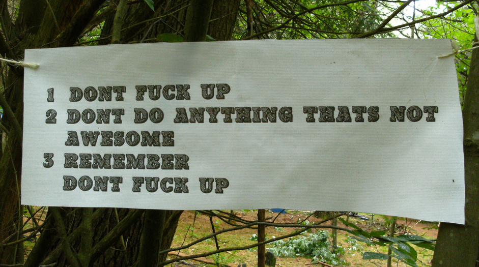 A sign in the woods reads: 1, Don't fuck up. 2, Don't do anything that isn't awesome. 3, Remember, don't fuck up.
